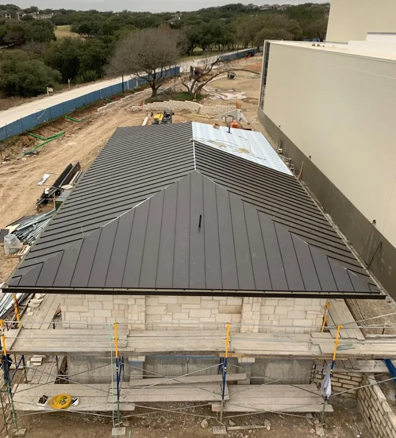 Metal roof new construction with scaffolding in Gloucester